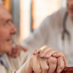 casual-senior-man-home-with-doctor.jpg